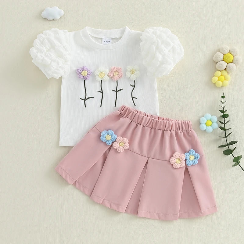 Conjunto Infantil Menina - Blusa Manga Bufante e Saia A-Line com Flores Crochê, com esse conjunto sua filha estará sempre fashion! Com a bela combinação de blusa com manga bufante e saia A-Line com flores em crochê, ela ficará encantadora em qualquer ocasião. Além disso, o conjunto oferece conforto e estilo para sua pequena arrasar!